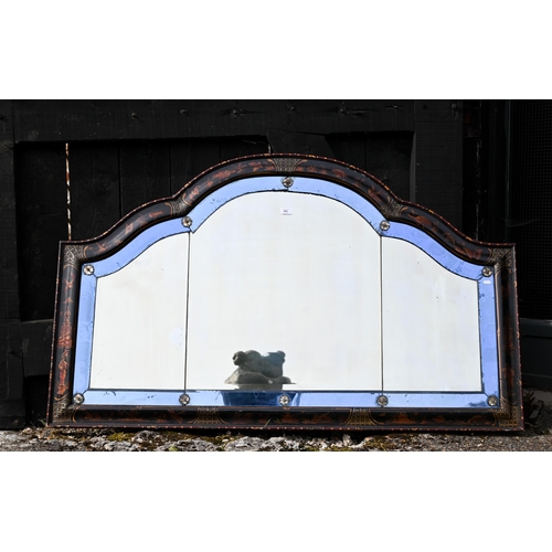 861 - A Chinoiserie decorated arched top over-mantel with blue glass bordered mirror, circa 1900, 150 cm x... 