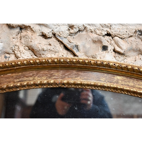 862 - A large Victorian oval giltwood framed mirror, 145 cm x 112 cm