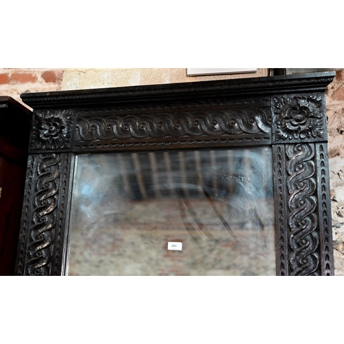 864 - A large 17th century style carved oak framed tall mirror, circa 1900, size cm x cm h