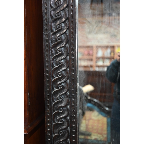 864 - A large 17th century style carved oak framed tall mirror, circa 1900, size cm x cm h