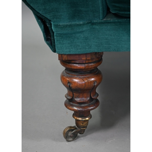 866 - A Victorian rosewood framed scroll end chaise lounge, in teal fabric with seat cushion and raised on... 