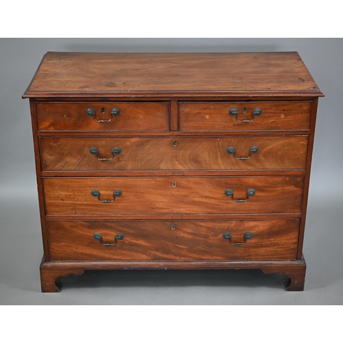 867 - A George III mahogany chest of two short over three long graduated drawers, with (later) brass fitti... 