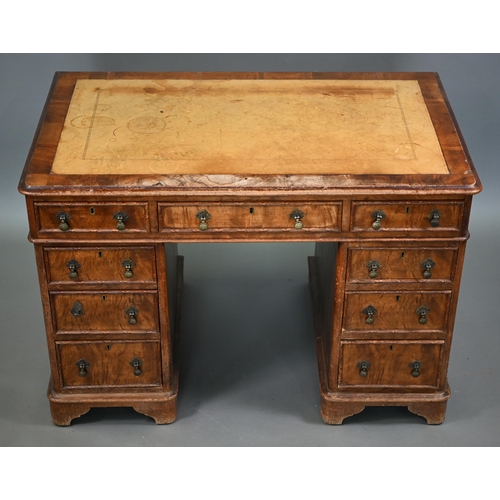 874 - A Victorian walnut twin pedestal desk, the inset tan leather top over an arrangement of moulded edge... 