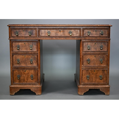 874 - A Victorian walnut twin pedestal desk, the inset tan leather top over an arrangement of moulded edge... 