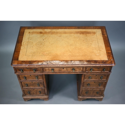 874 - A Victorian walnut twin pedestal desk, the inset tan leather top over an arrangement of moulded edge... 