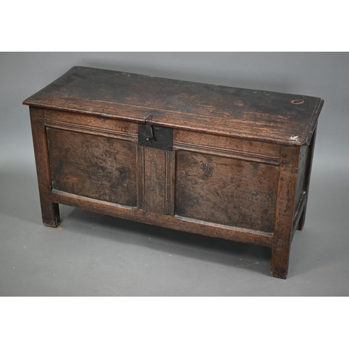 880 - A late 17th/18th century joint oak coffer, the two plank top a twin panelled front, on stiles, 104 c... 