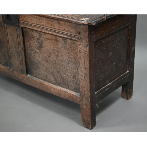 880 - A late 17th/18th century joint oak coffer, the two plank top a twin panelled front, on stiles, 104 c... 