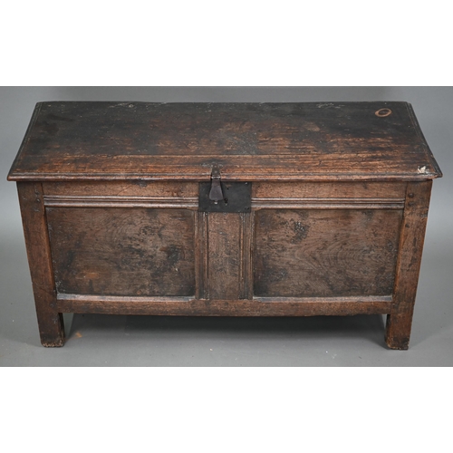 880 - A late 17th/18th century joint oak coffer, the two plank top a twin panelled front, on stiles, 104 c... 