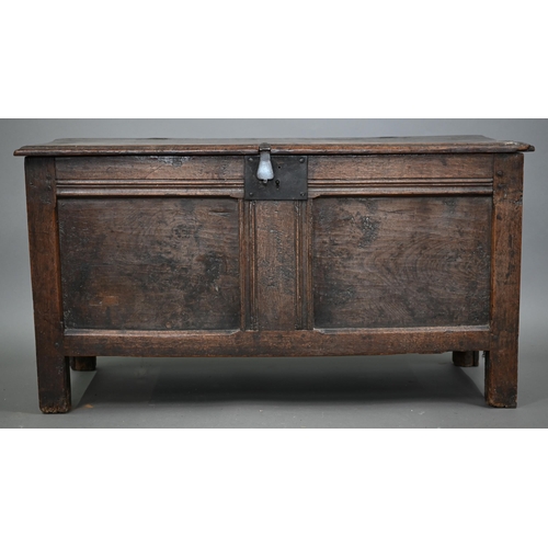 880 - A late 17th/18th century joint oak coffer, the two plank top a twin panelled front, on stiles, 104 c... 