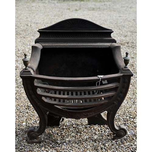 884 - An antique cast iron and brass urn finial Adam style fire basket, with bow front raised on scroll fr... 