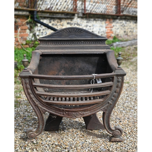 884 - An antique cast iron and brass urn finial Adam style fire basket, with bow front raised on scroll fr... 