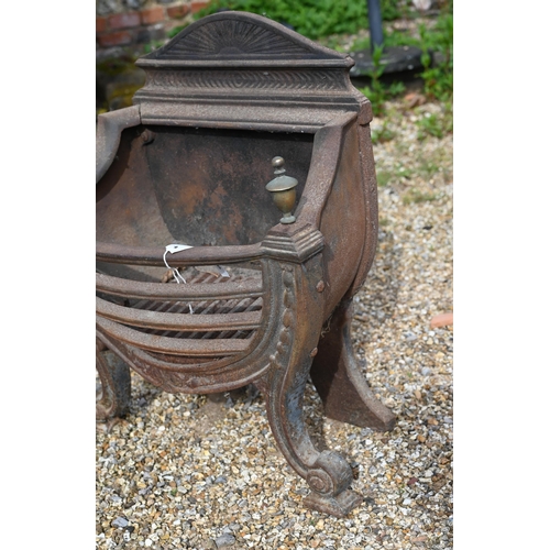 884 - An antique cast iron and brass urn finial Adam style fire basket, with bow front raised on scroll fr... 