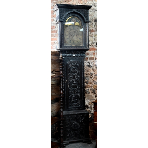 888 - J Newton, Hexham, an 18th century profusely carved and moulded oak longcase clock, the 8-day movemen... 