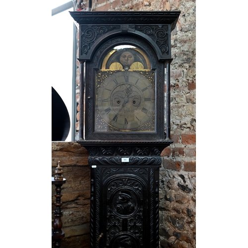 888 - J Newton, Hexham, an 18th century profusely carved and moulded oak longcase clock, the 8-day movemen... 