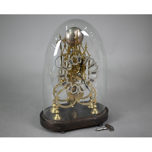 894 - A brass skeleton clock, the single fusee movement with silvered dial raised on an ebonised plinth un... 