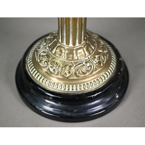 904 - An antique brass column and etched glass shade oil lamp, raised on a brown glazed pottery base, 67 c... 