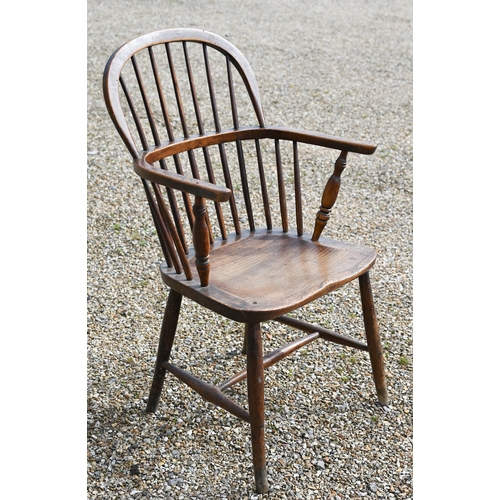 905 - An antique elm seat hoop and stick-back Windsor chair, raised on turned legs and stretchers