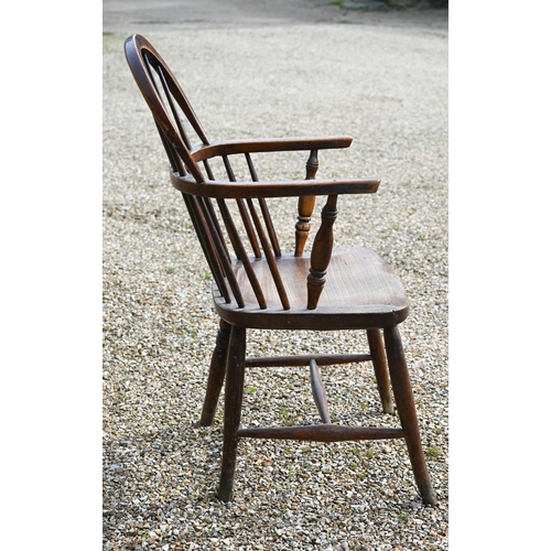 905 - An antique elm seat hoop and stick-back Windsor chair, raised on turned legs and stretchers