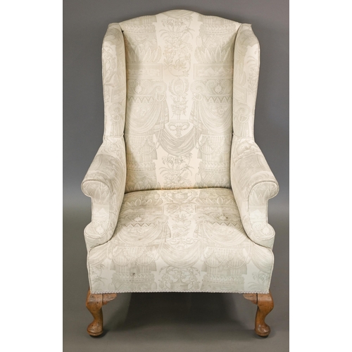 906 - A Georgian style wingback armchair in pale regency print fabric, raised on bleached cabriole front l... 