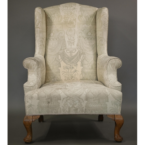 906 - A Georgian style wingback armchair in pale regency print fabric, raised on bleached cabriole front l... 