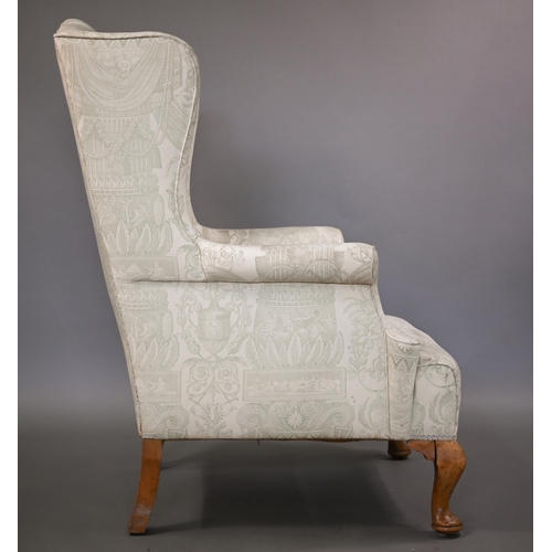 906 - A Georgian style wingback armchair in pale regency print fabric, raised on bleached cabriole front l... 