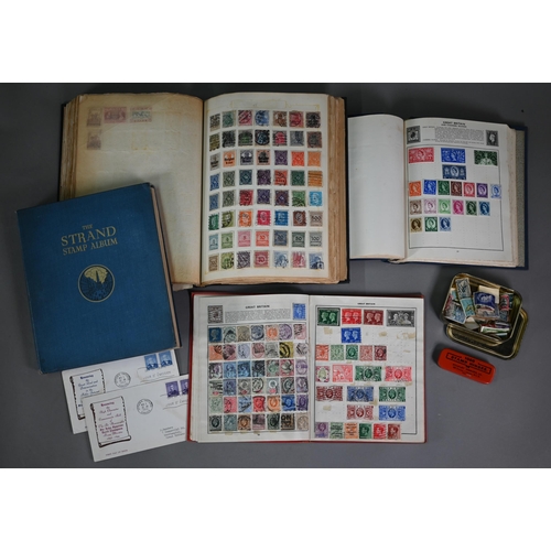 921 - Four albums of Victorian and later British Empire and foreign postage stamps, to/w a tin of loose st... 