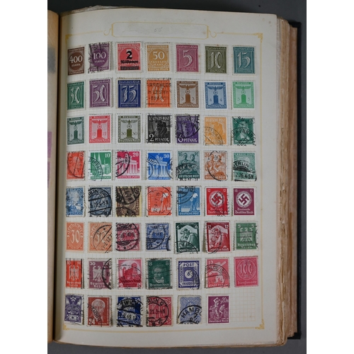 921 - Four albums of Victorian and later British Empire and foreign postage stamps, to/w a tin of loose st... 