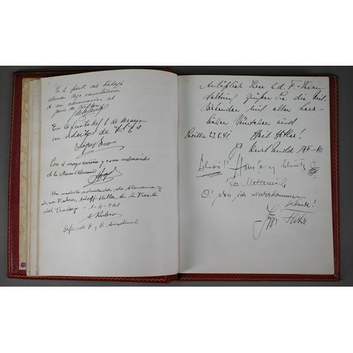 925 - A German gilt-tooled red Morocco leather visitors' book, Seville 1938 - 1943, signed and inscribed b... 