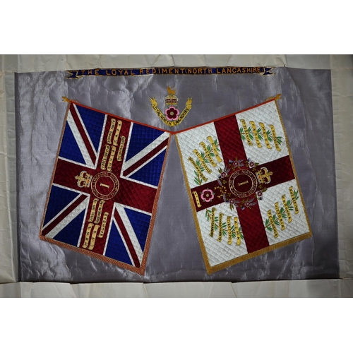 940 - A silk embroidered panel - battle honours and badge of the 'Loyal North Lancashire Regiment', colour... 