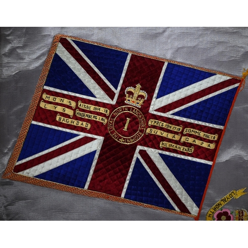 940 - A silk embroidered panel - battle honours and badge of the 'Loyal North Lancashire Regiment', colour... 