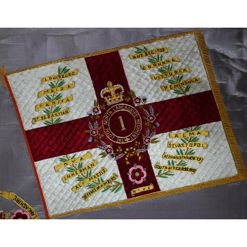 940 - A silk embroidered panel - battle honours and badge of the 'Loyal North Lancashire Regiment', colour... 