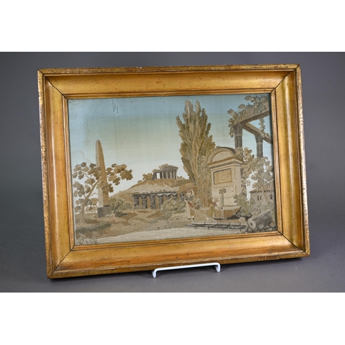 944 - A 19th century silk needlework picture of Arcadian ruins, 28 x 41 cm, framed and glazed