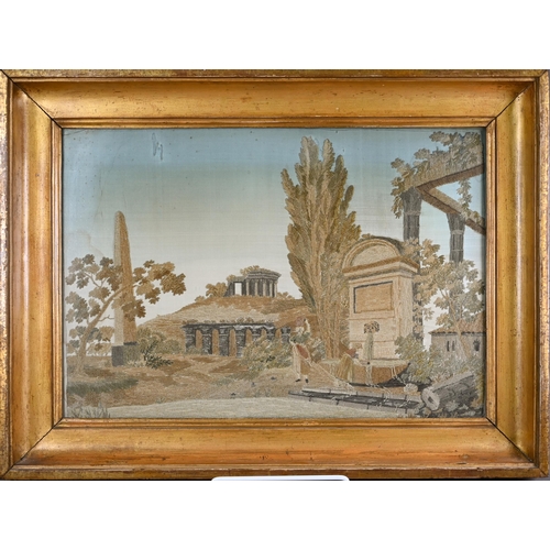 944 - A 19th century silk needlework picture of Arcadian ruins, 28 x 41 cm, framed and glazed