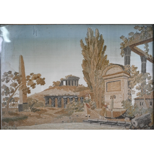 944 - A 19th century silk needlework picture of Arcadian ruins, 28 x 41 cm, framed and glazed