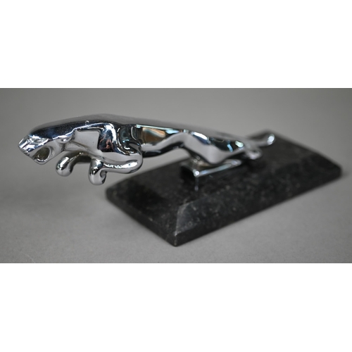 952 - A chrome Jaguar car mascot, 19cm long and a small 'Spirit of Ecstasy' mascot 7cm - both on stone pli... 