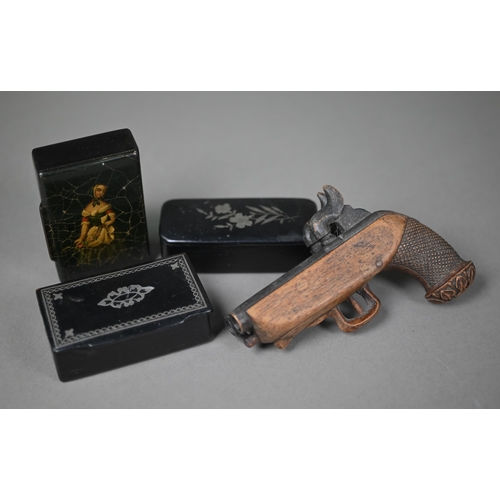 963 - An antique novelty carved wood snuff box in the form of a double-barrelled pistol, to/w three papier... 