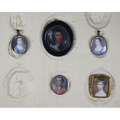 975 - A group of portrait miniatures in frame comprising a Georgian oval portrait miniature on ivory of a ... 