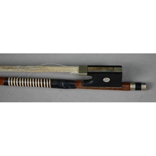 976 - A violin bow stamped 'Dodd', 73 cm long, to/w an antique wooden violin case