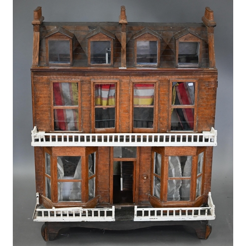 977 - A large late Victorian three-storey villa doll's house with double-bay front, 119 cm high x 100 cm w... 