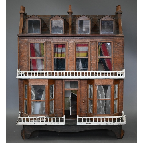 977 - A large late Victorian three-storey villa doll's house with double-bay front, 119 cm high x 100 cm w... 