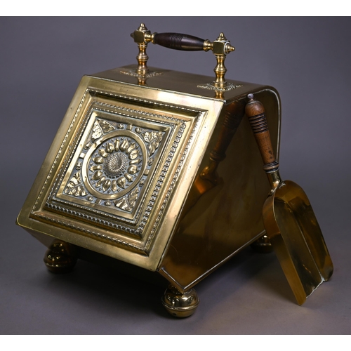 979 - An Arts & Crafts brass coal scuttle in the manner of Benson/Dresser, with turned wood handle and... 