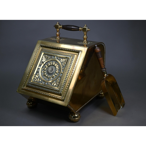 979 - An Arts & Crafts brass coal scuttle in the manner of Benson/Dresser, with turned wood handle and... 