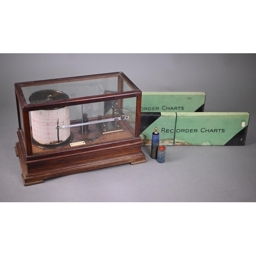 992 - A vintage barograph in glazed oak case, 32 cm wide, to/w two boxes of spare charts and a bottle of i... 