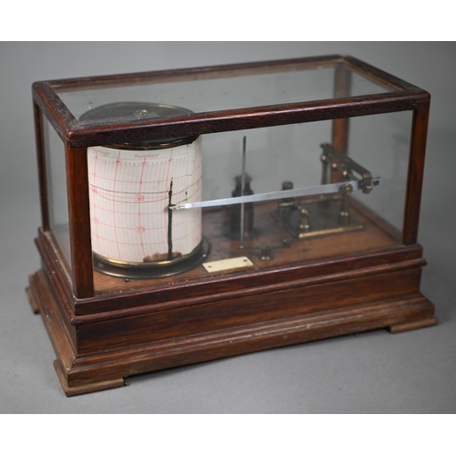 992 - A vintage barograph in glazed oak case, 32 cm wide, to/w two boxes of spare charts and a bottle of i... 