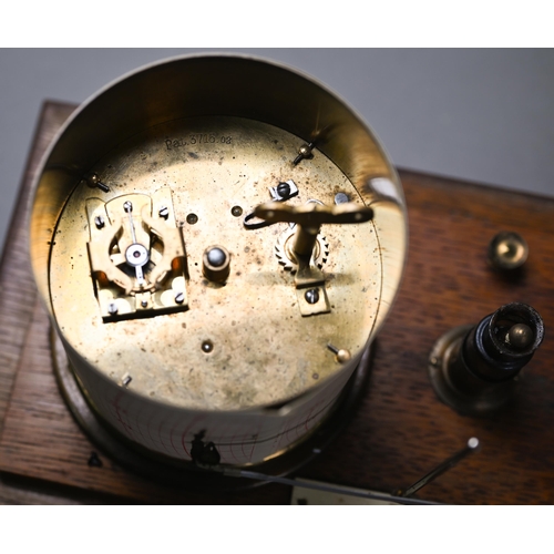 992 - A vintage barograph in glazed oak case, 32 cm wide, to/w two boxes of spare charts and a bottle of i... 