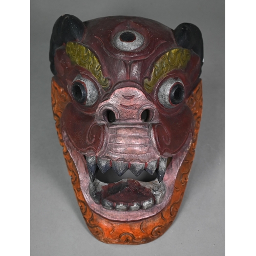 996 - An African tribal mask with bone inlays, surmounted by elephant head-piece, 56 cm high, to/w an Asha... 