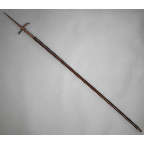 997 - A vintage Indian Mahout's ankusha (elephant goad) with steel top and wooden shaft, 140 cm long