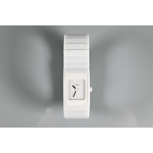 432 - Rado, a white cased lady's wristwatch, quartz movement, on deployment bracelet, with box, manual and... 