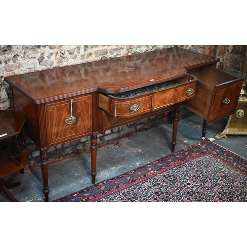 817 - An inlaid Regency inlaid mahogany sideboard, centred by a bow-fronted drawer over a recessed arched ... 