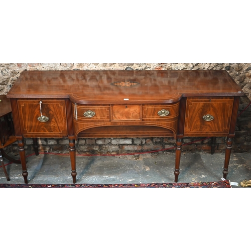 817 - An inlaid Regency inlaid mahogany sideboard, centred by a bow-fronted drawer over a recessed arched ... 